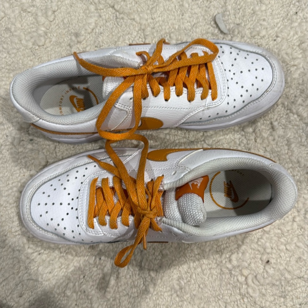 White and orange Nike sneakers